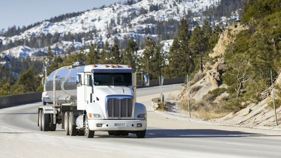 interstate-truck-on-snowy-mountain-pass.png